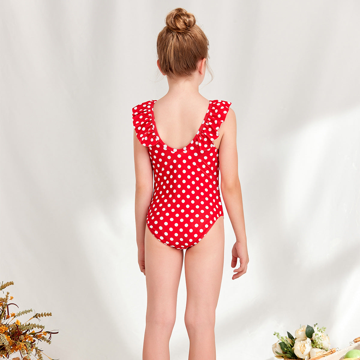 Women's one-piece swimsuit with playful polka dot design and ruffle details Ivyshape