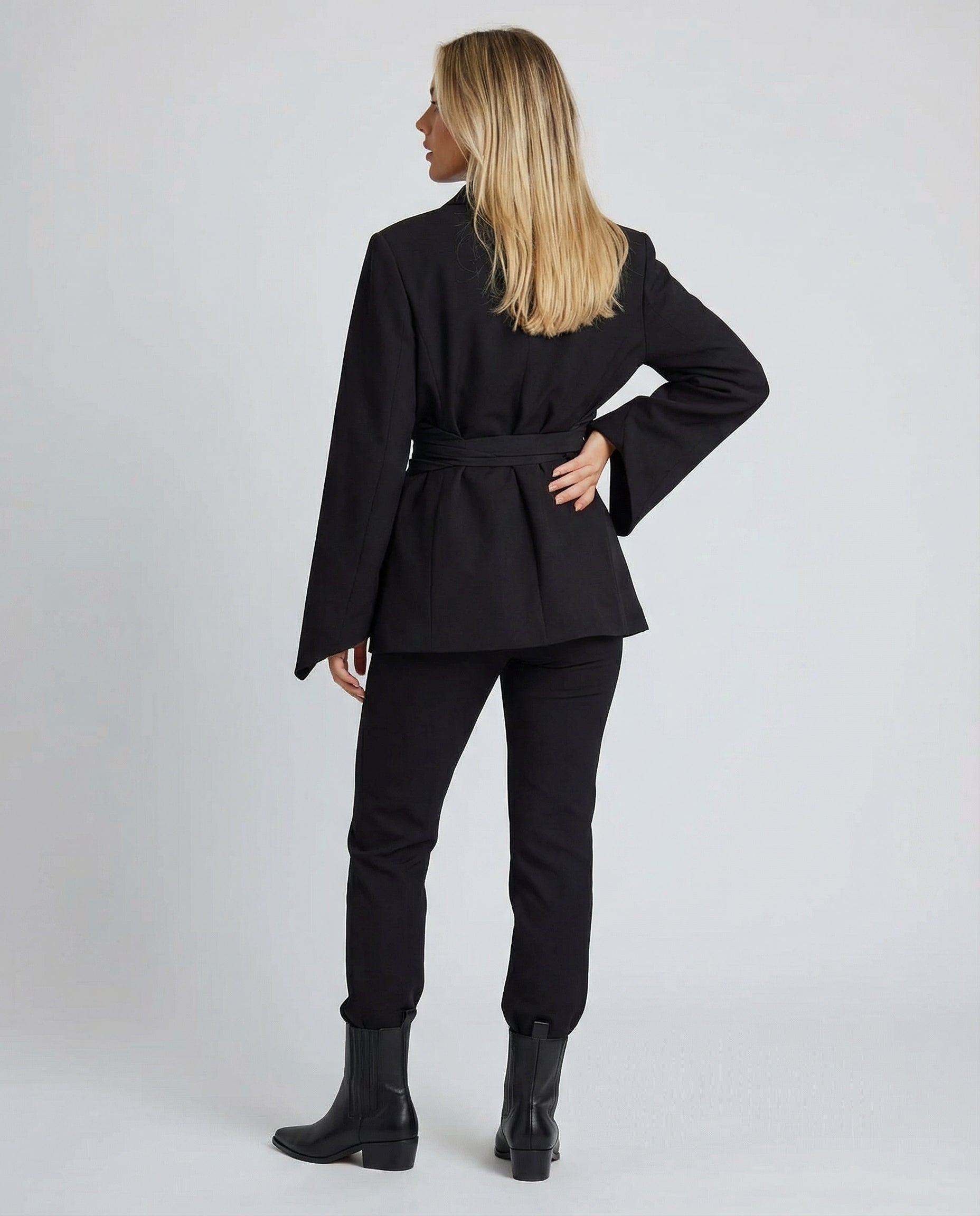 belted blazer with tailored waist-defining silhouette and structured design