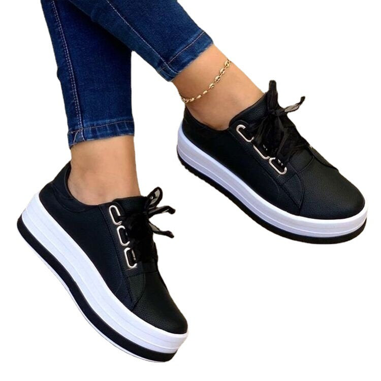 Women's sporty platform sneakers with a glossy surface and modern laces Ivyshape