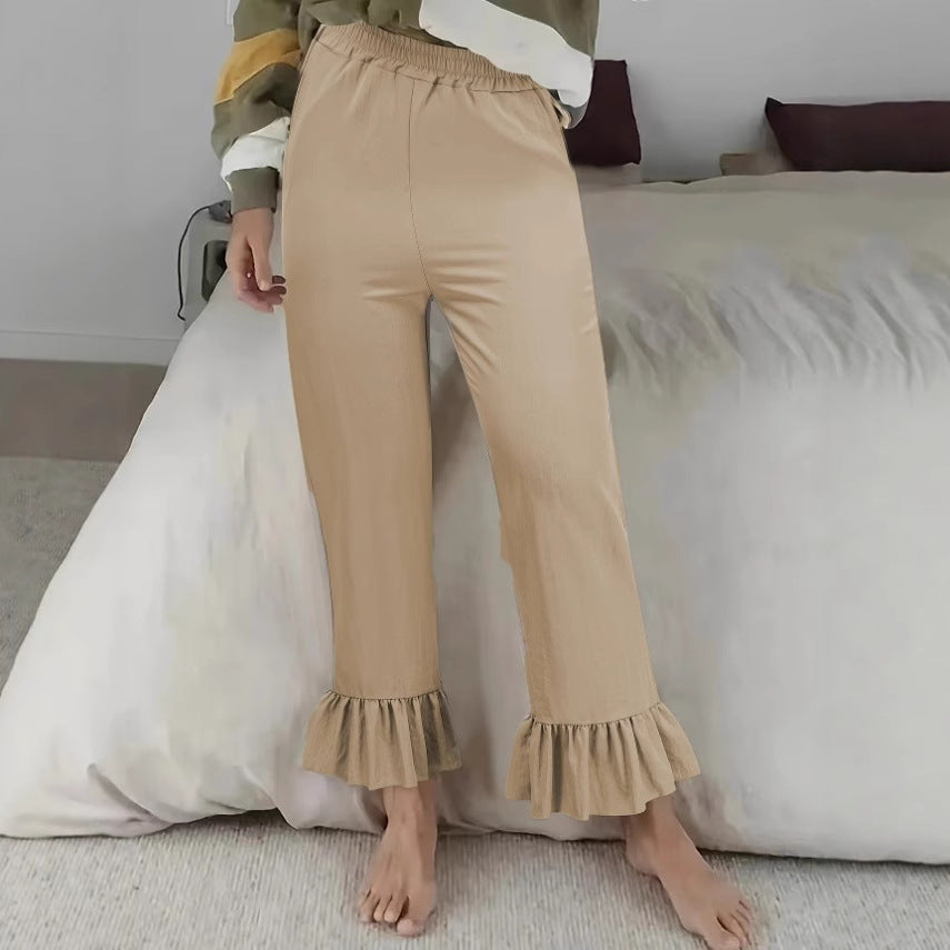 Ladies flared trousers with playful ruffle details Ivyshape