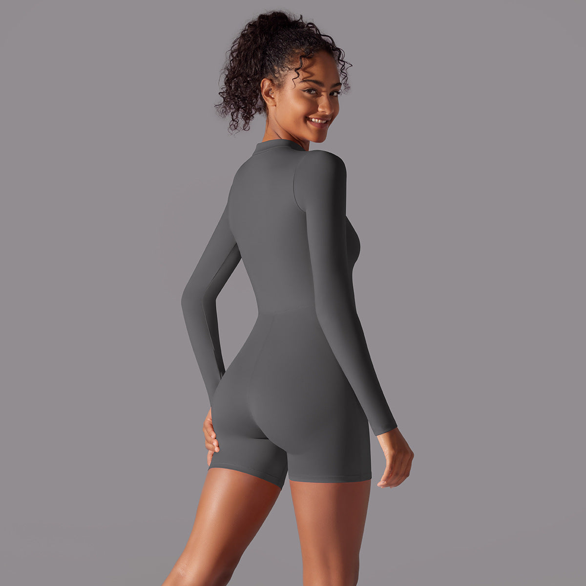 Women's sporty full bodysuit with long sleeves and light zip opening Ivyshape
