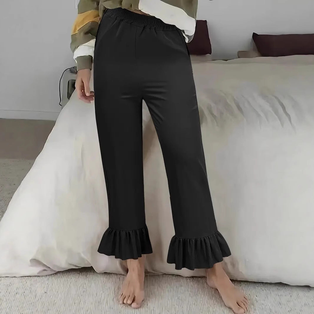 Ladies flared trousers with playful ruffle details Ivyshape