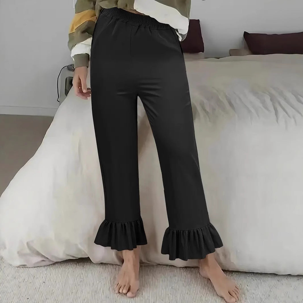 Ladies flared trousers with playful ruffle details Ivyshape