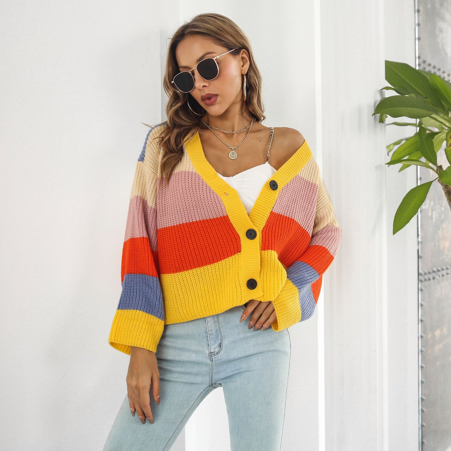 Women's chunky knit cardigan with button details and trendy color play Ivyshape