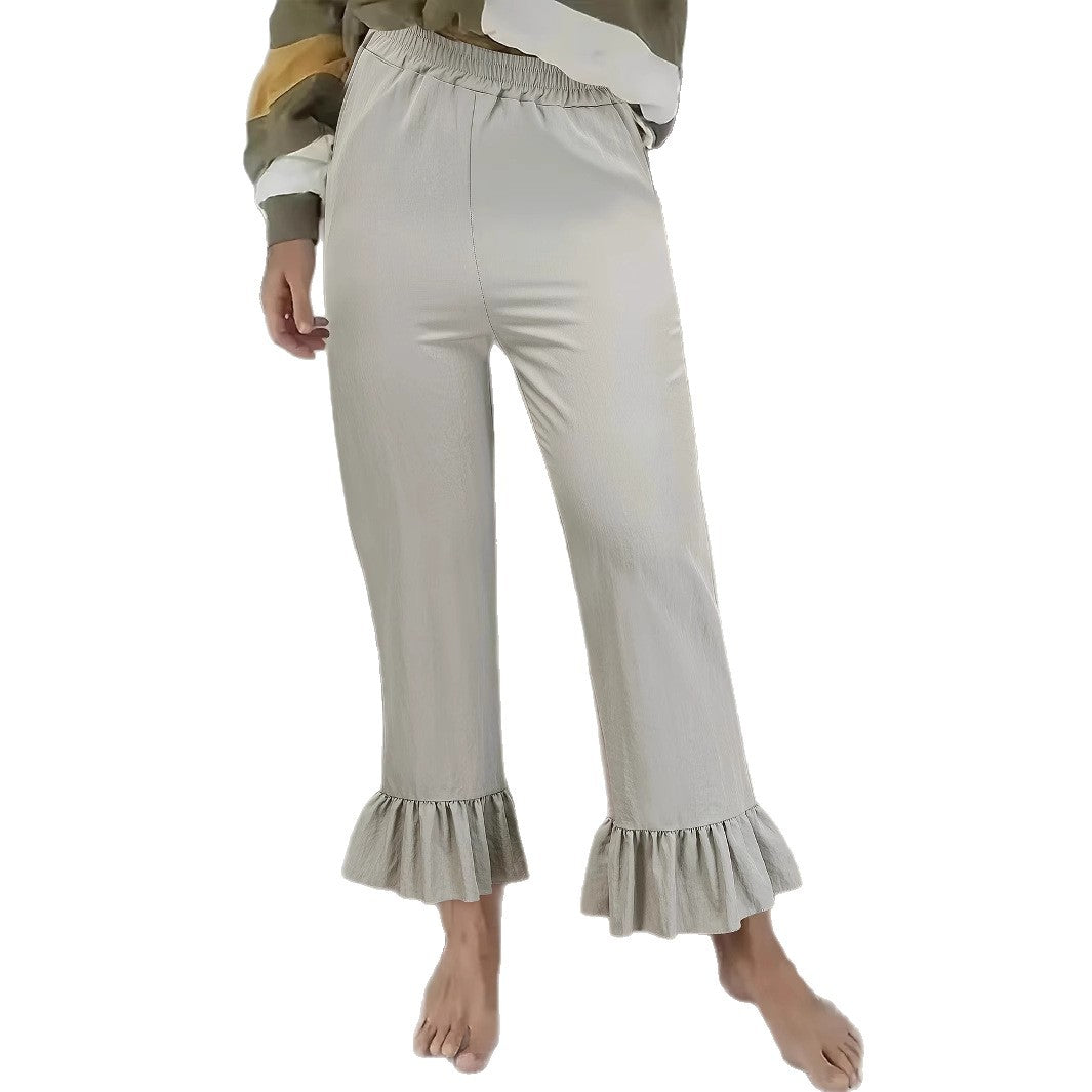 Ladies flared trousers with playful ruffle details Ivyshape