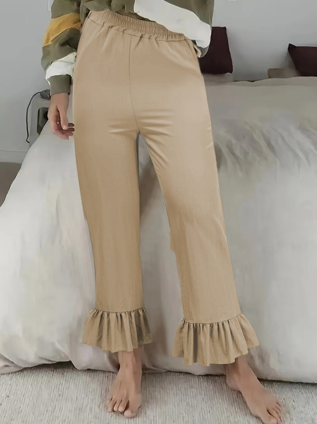 Ladies flared trousers with playful ruffle details Ivyshape