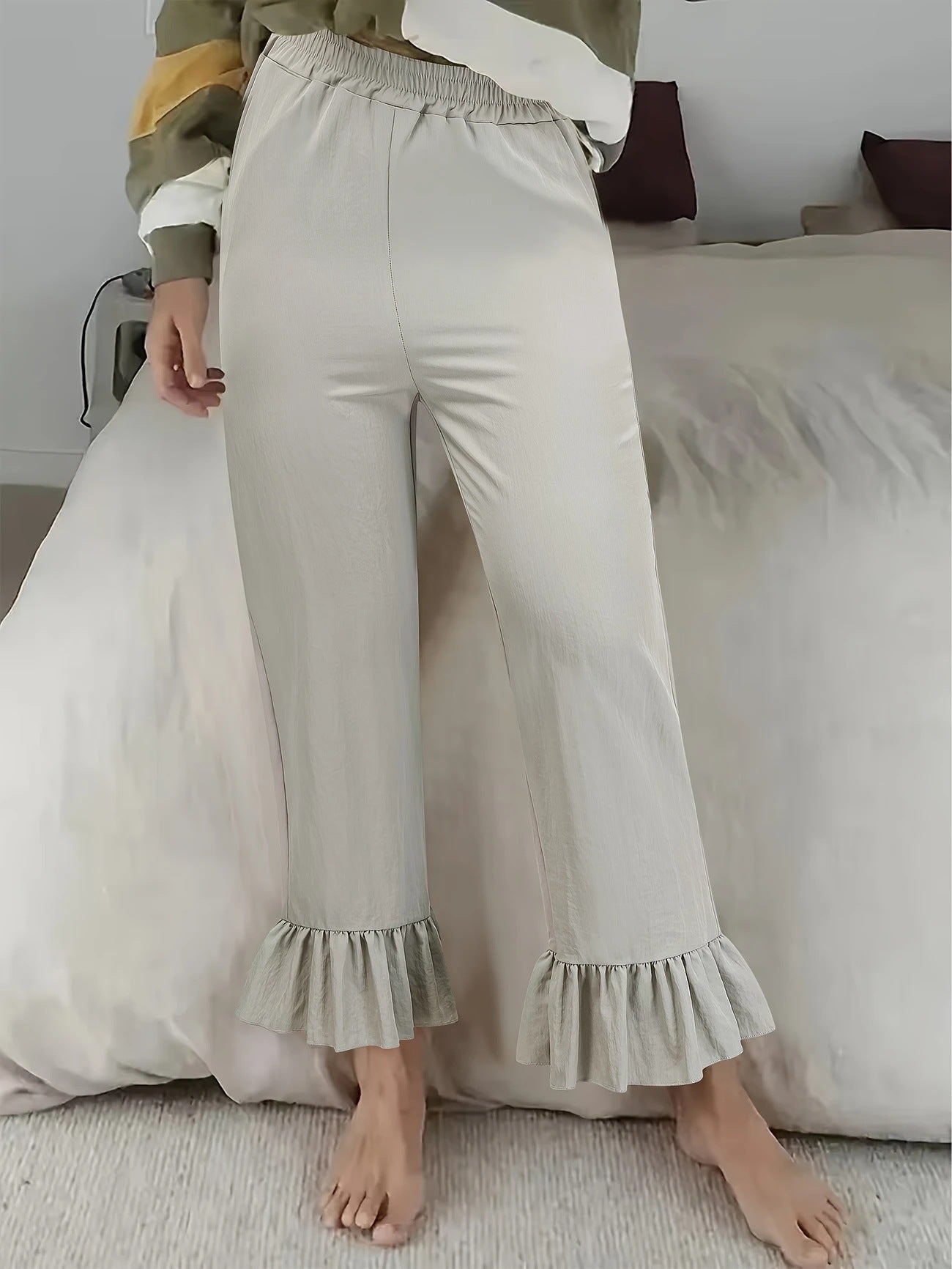 Ladies flared trousers with playful ruffle details Ivyshape
