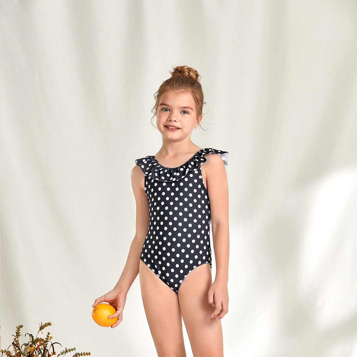 Women's one-piece swimsuit with playful polka dot design and ruffle details Ivyshape