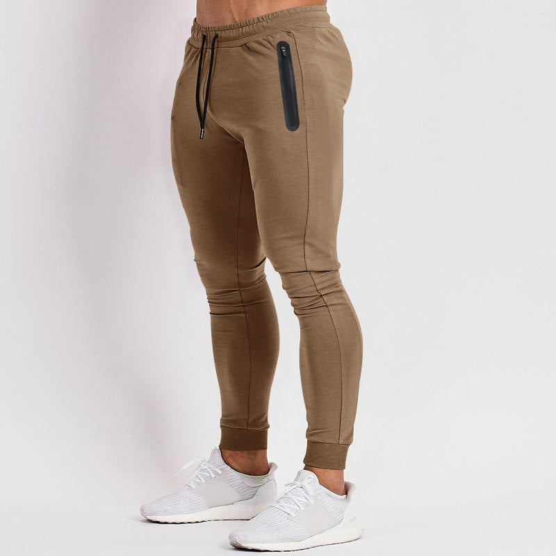Men's sporty fitness pants with breathable inserts and practical zip pockets Ivyshape