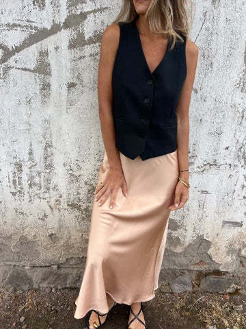 Ladies two-piece set consisting of sleeveless vest and shiny skirt Ivyshape