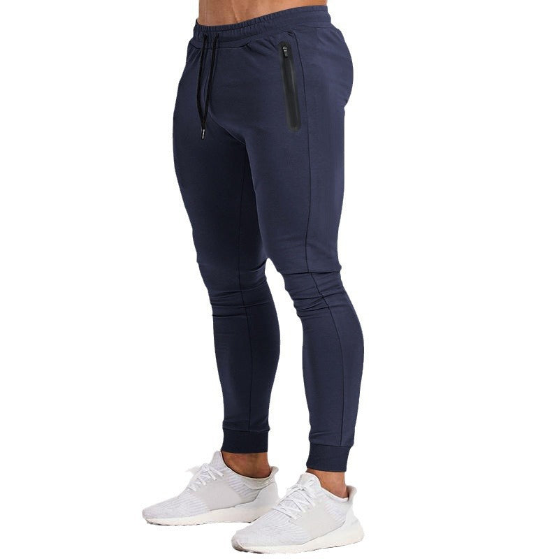 Men's sporty fitness pants with breathable inserts and practical zip pockets Ivyshape