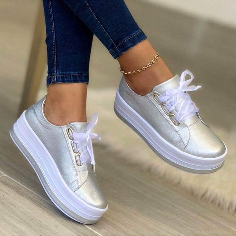 Women's sporty platform sneakers with a glossy surface and modern laces Ivyshape