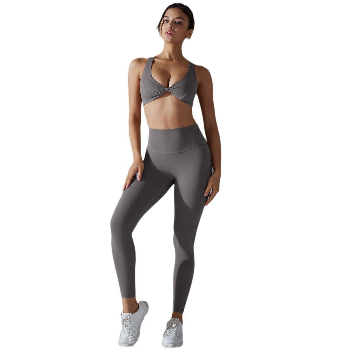 Women's sports bra with elegant twist design and high-waisted leggings Ivyshape